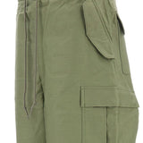 Pantaloni con tasche cargo in verde Junya watanabe - uomo 