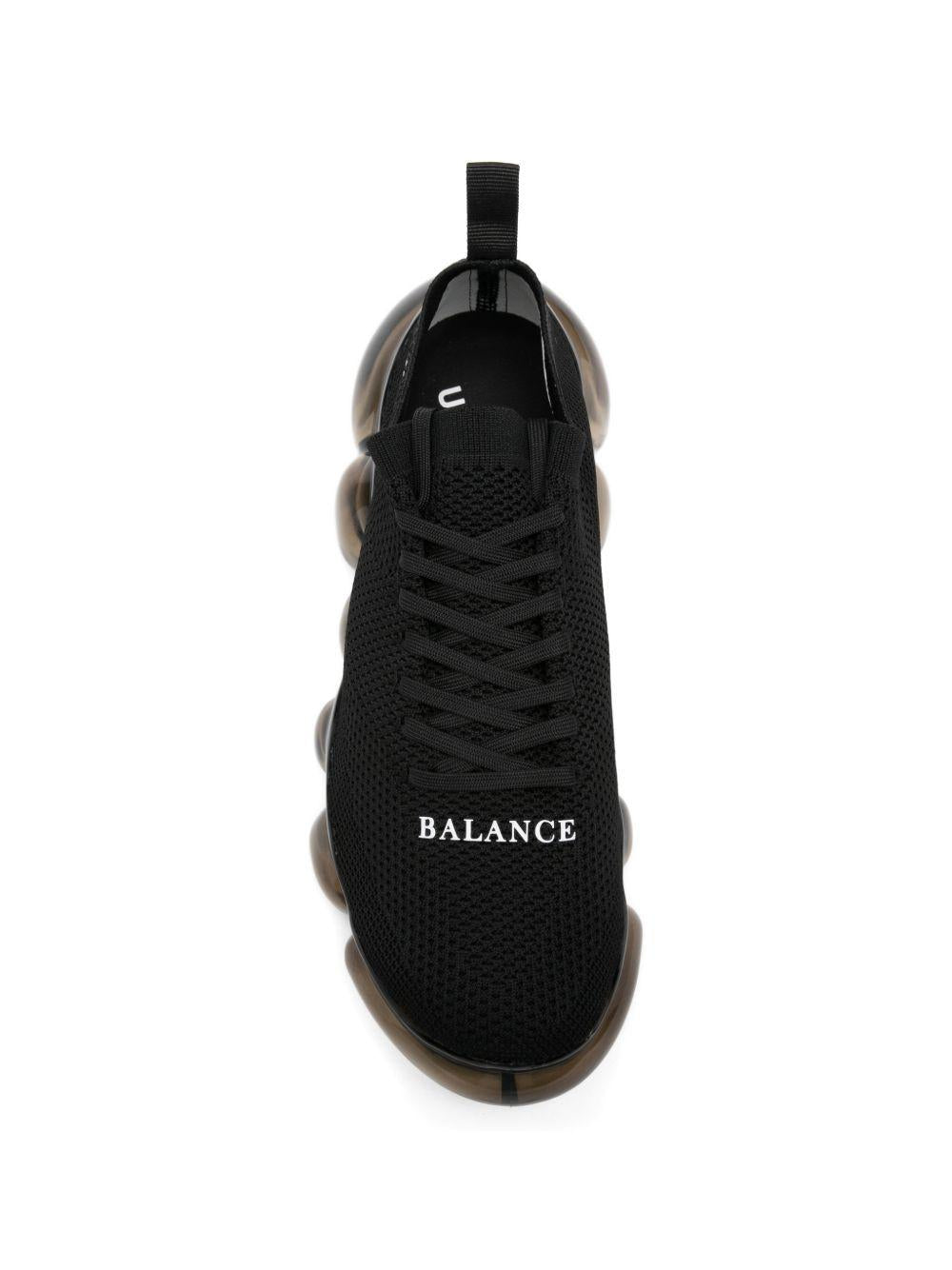 Sneakers con suola a bolle in nero Undercover - uomo 