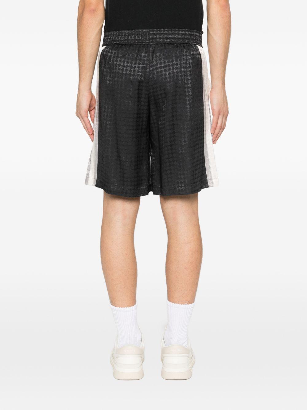 Pantaloncini con coulisse a quadri in nero Amiri - uomo 