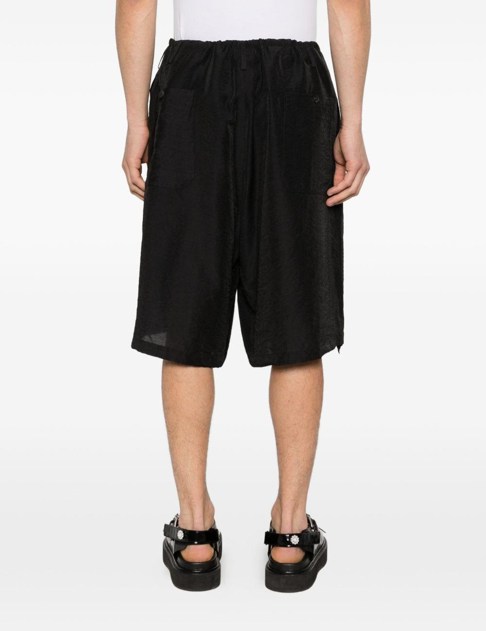 Shorts con orlo a coulisse in nero Yohji yamamoto - uomo 