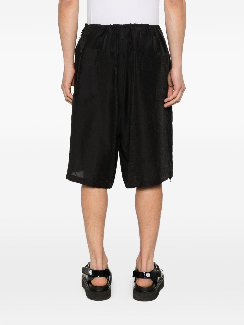 Shorts con orlo a coulisse in nero Yohji yamamoto - uomo 