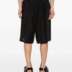 Shorts con orlo a coulisse in nero Yohji yamamoto - uomo 