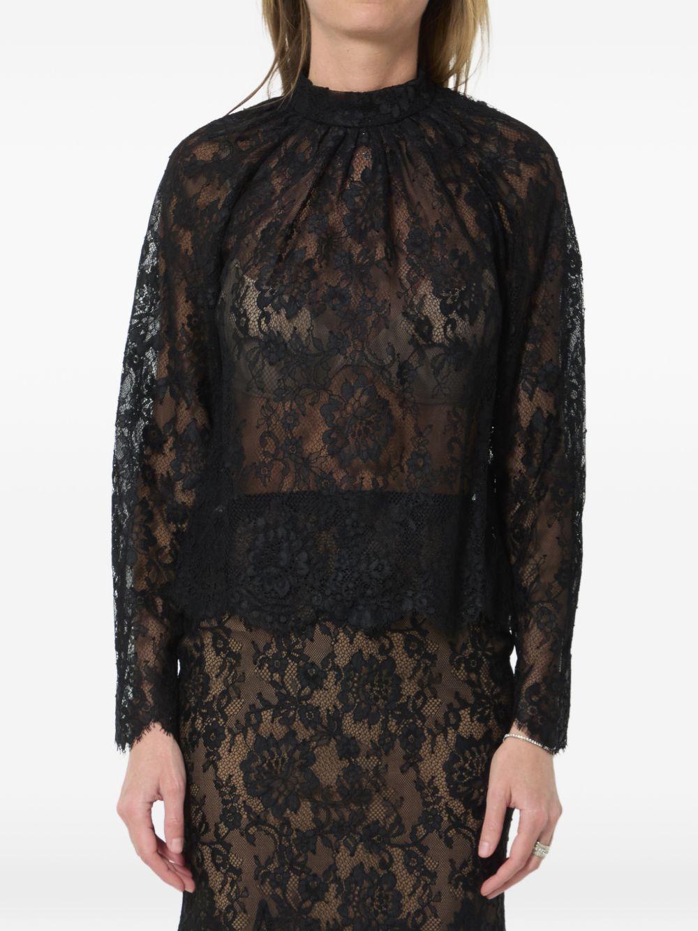Blusa in pizzo in nero 