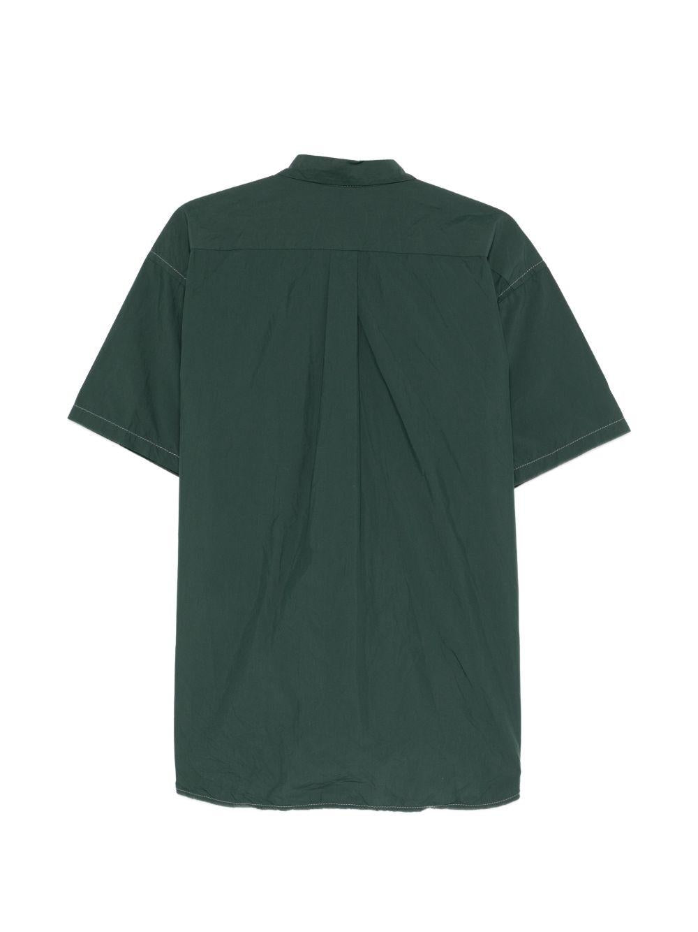 Camicia a maniche corte con moschettone in verde And wander - uomo 