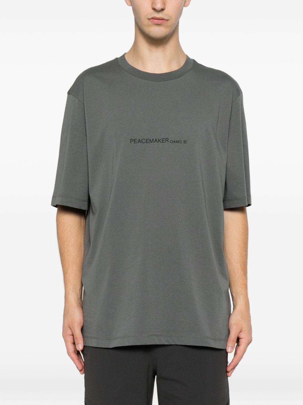 T-shirt con stampa grafica "Peacemaker" in grigio Oamc peacemaker - uomo 