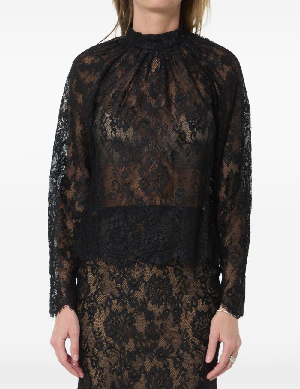 Blusa in pizzo in nero 