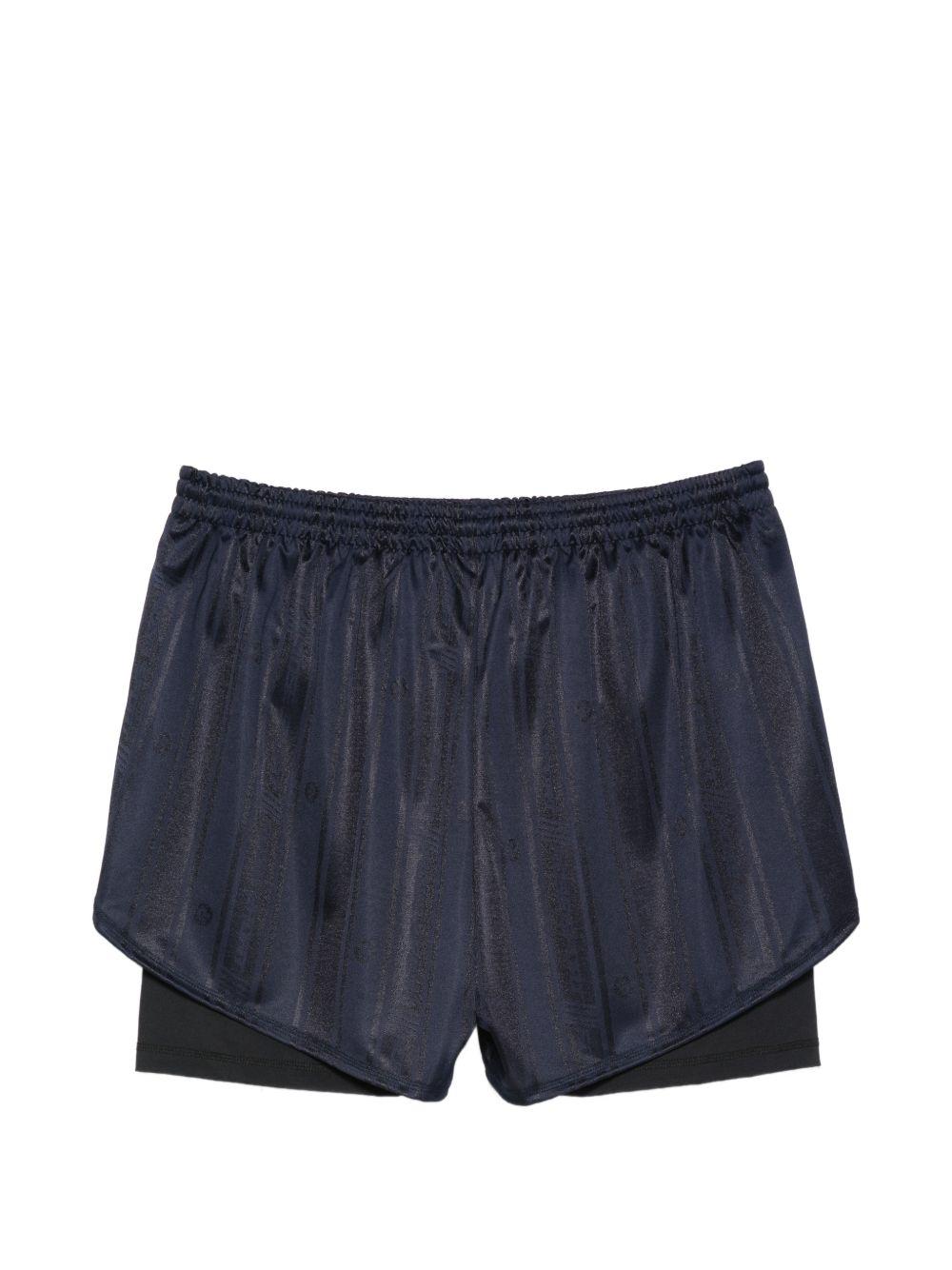 Pantaloncini con dettagli a righe in blu Martine rose - unisex 