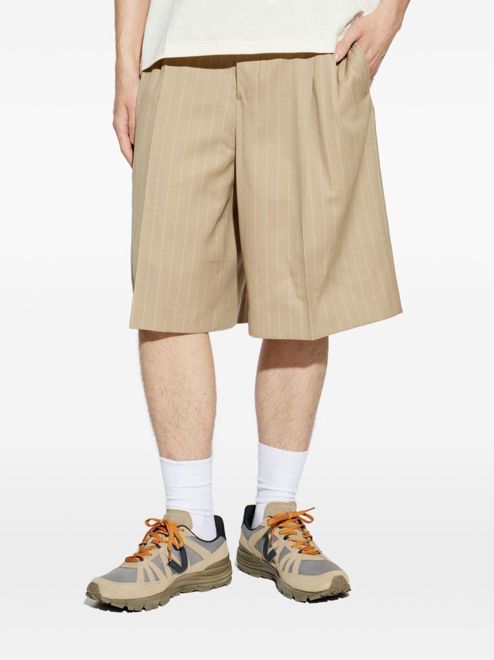 Shorts gessati con pieghe in beige Ami paris - uomo 