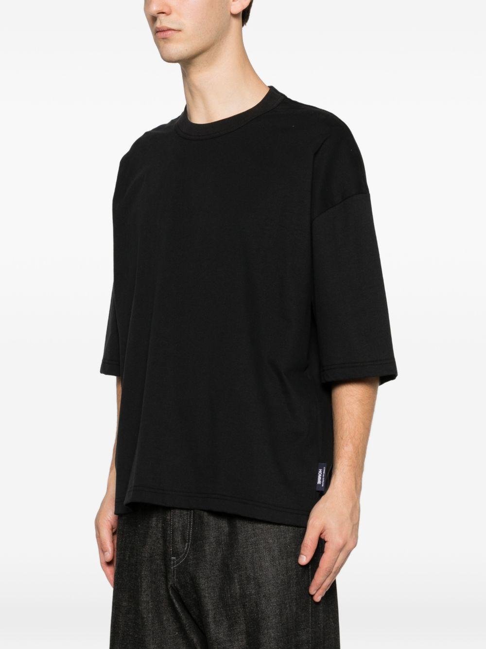 T-shirt a maniche corte in bianco Comme des garcons homme - uomo 