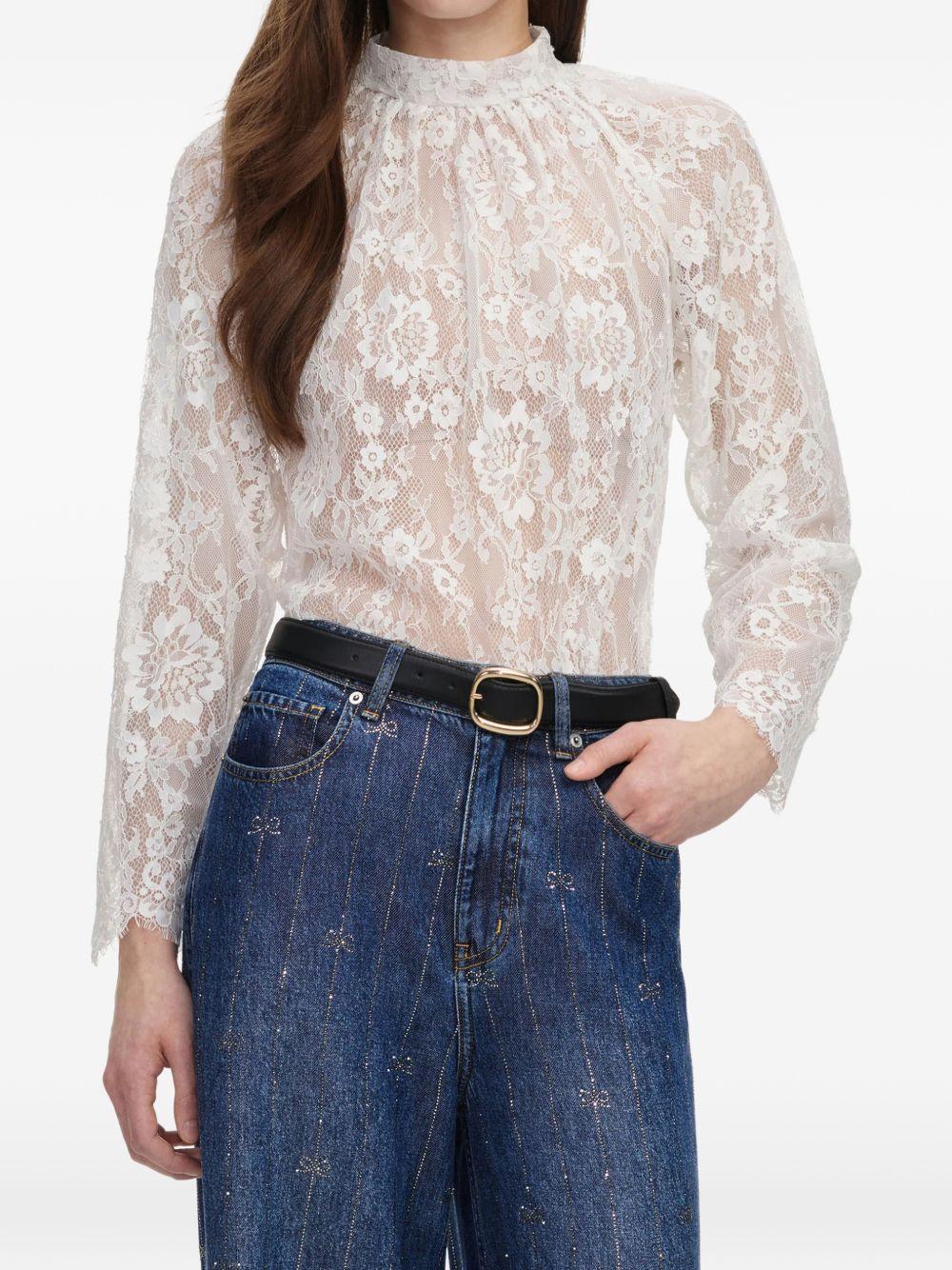 Blusa in pizzo in bianco 