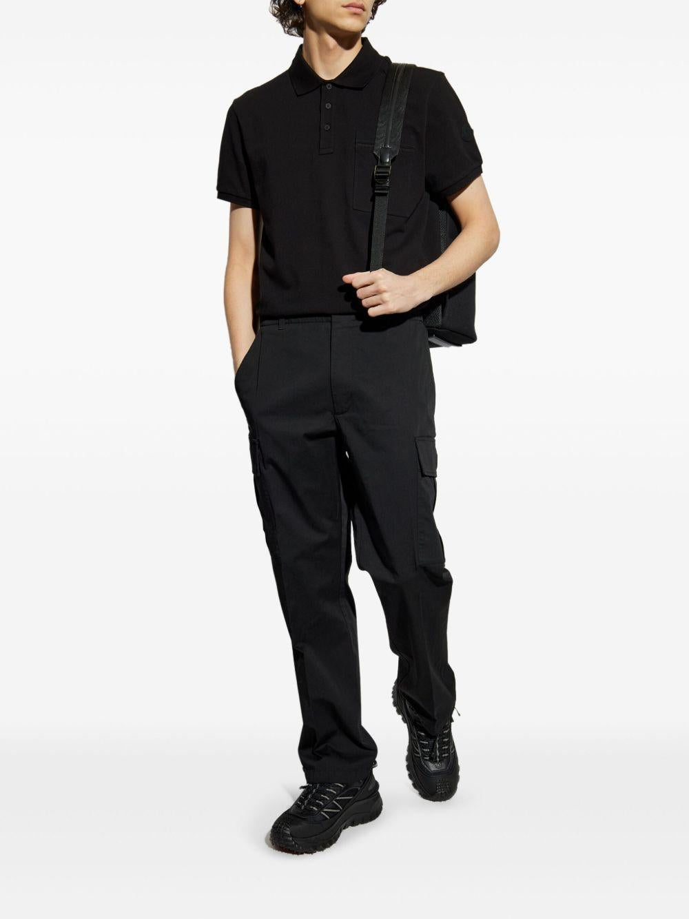 Polo con applicazione logo in nero Moncler - uomo 