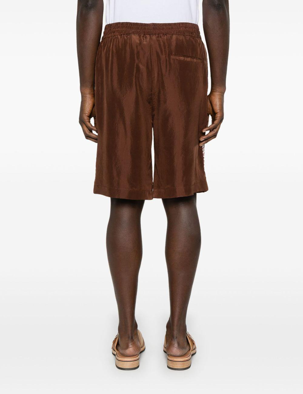 Shorts con stampa grafica in marrone Feng chen wang - uomo 