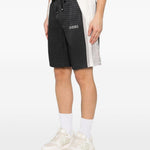 Pantaloncini con coulisse a quadri in nero Amiri - uomo 