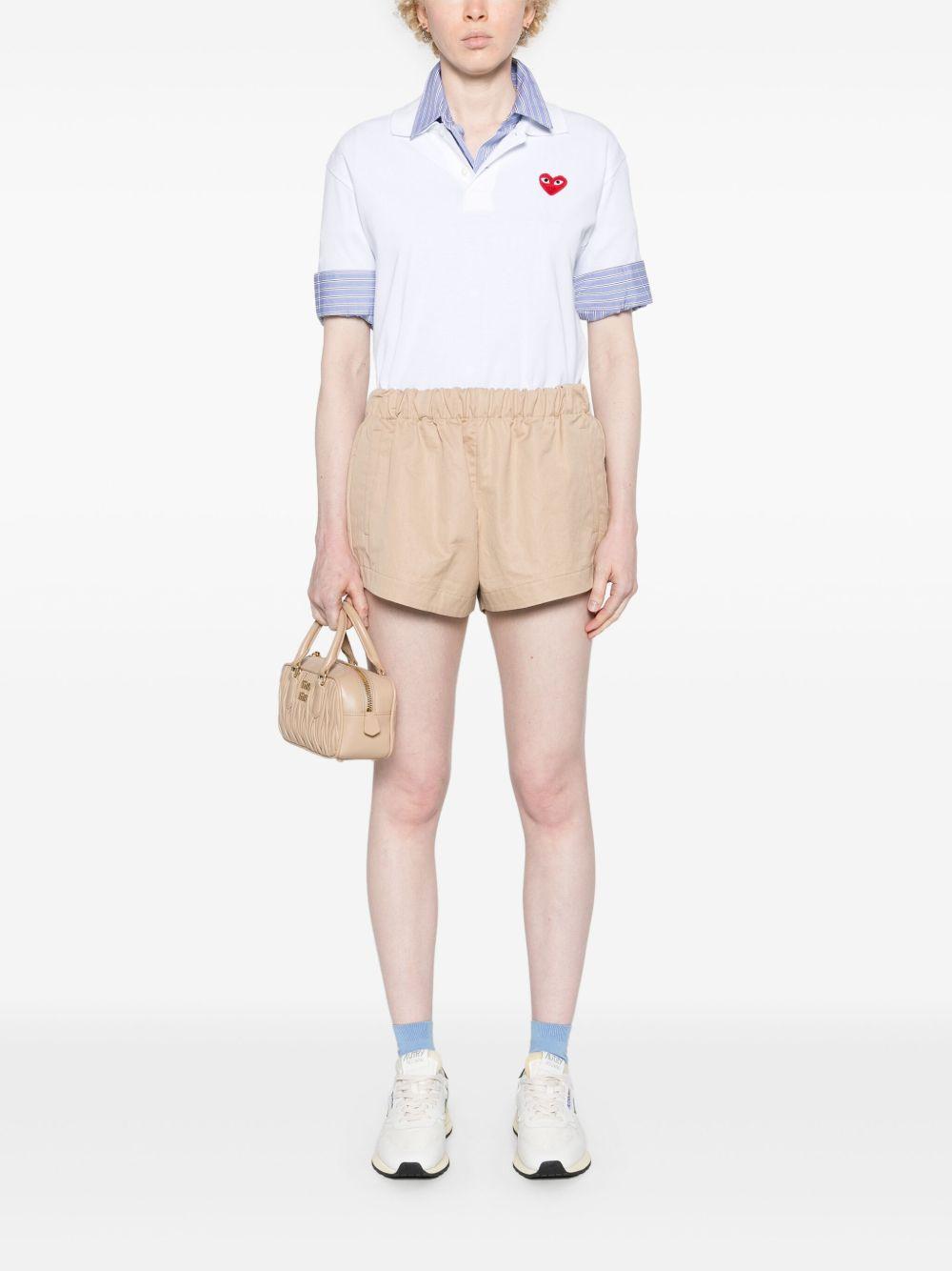Polo con applicazione in bianco Comme des garcons play - uomo 