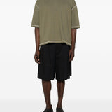 T-shirt con cuciture a contrasto in verde Comme des garcons homme - uomo 