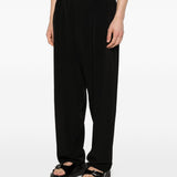Pantaloni con pieghe frontali in nero Yohji yamamoto - uomo 