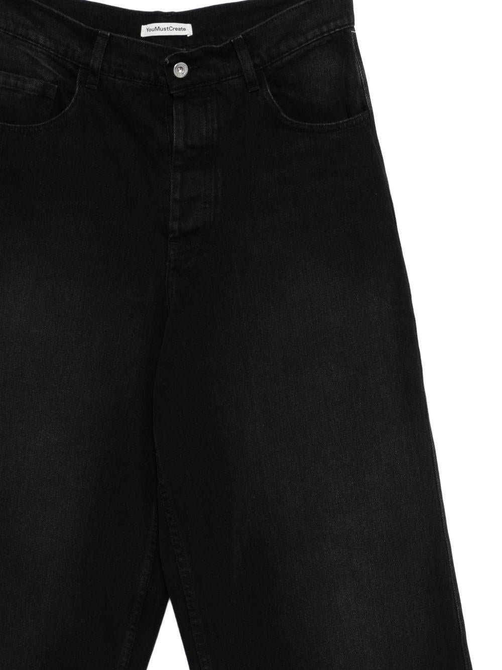 Jeans con bottoni in nero Ymc - uomo 