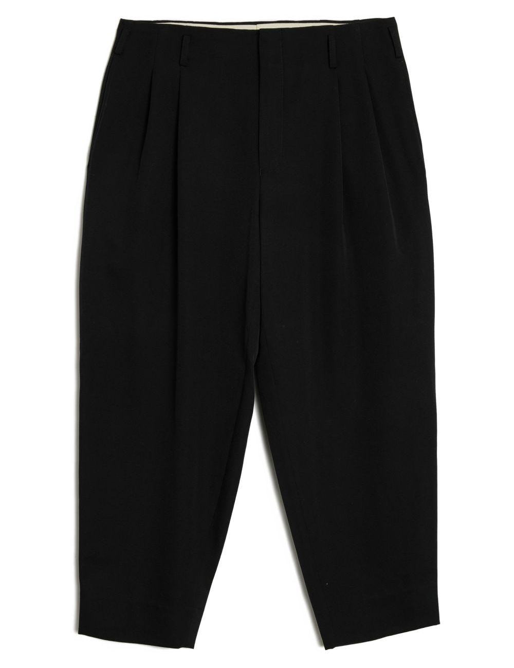 Pantaloni con pieghe in lana in nero Comme des garcons homme plus - uomo 