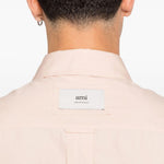 Camicia con logo posteriore in rosa chiaro Ami Paris - unisex 