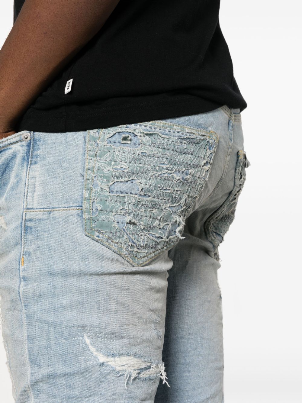 Jeans slim con effetto vissuto in blu - uomo PURPLE | PBP001LQDP