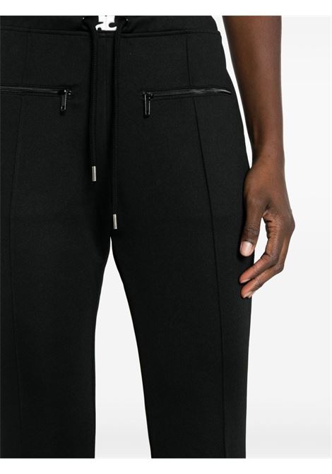 Black drawstring bootcut track trousers - women COURRÈGES | 423JPA177JS00919999