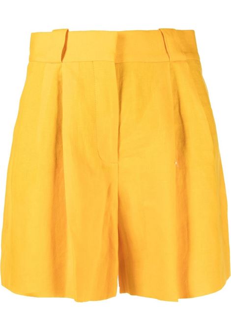 Pantaloncini con pieghe in giallo - donna