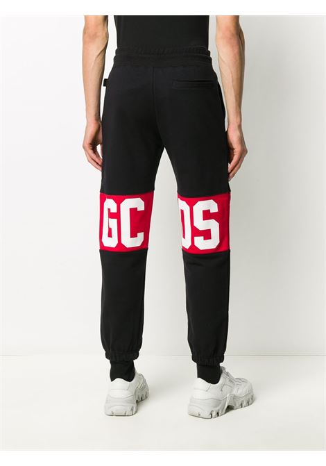 Black logo print track trousers - women GCDS | CC94M03100502