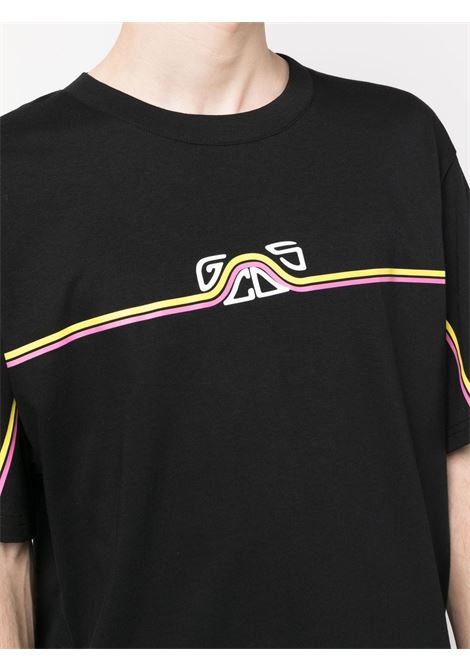 T-shirt con stampa logo in nero - uomo GCDS | SS23M13063302