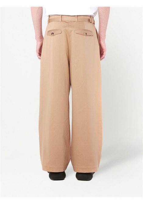 Pantaloni a gamba ampia con pieghe in beige - uomo JW ANDERSON | TR0272PG0947132