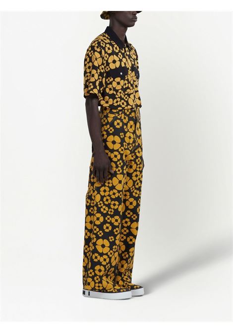 Pantaloni a gamba ampia con stampa floreale in nero e giallo - uomo MARNI X CARHARTT WIP | PUMU031293UTX001MFY70