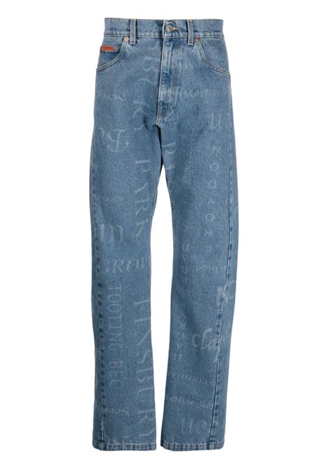 Jeans con stampa monogramma in blu - uomo