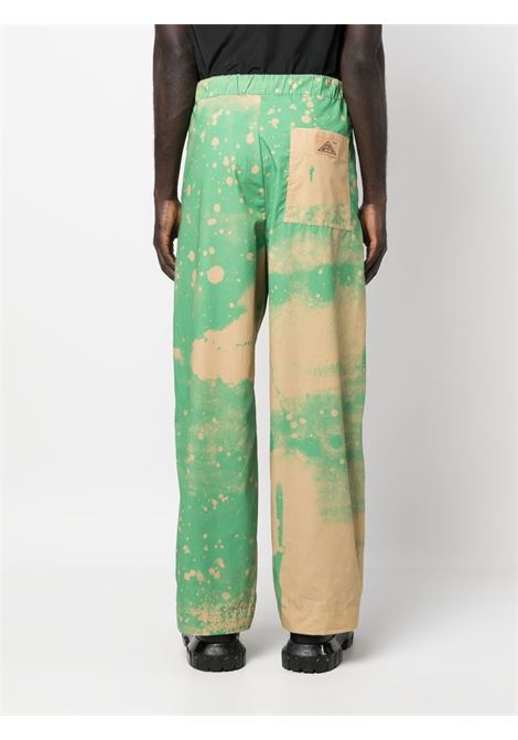 Pantaloni sportivi con effetto vernice spray in verde e beige - uomo OAMC | 23E28OAU31COTOA043324