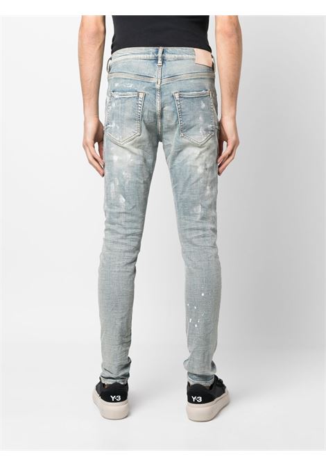 Jeans skinny strappati con schizzi di vernice in blu - uomo PURPLE | PBP001LIA