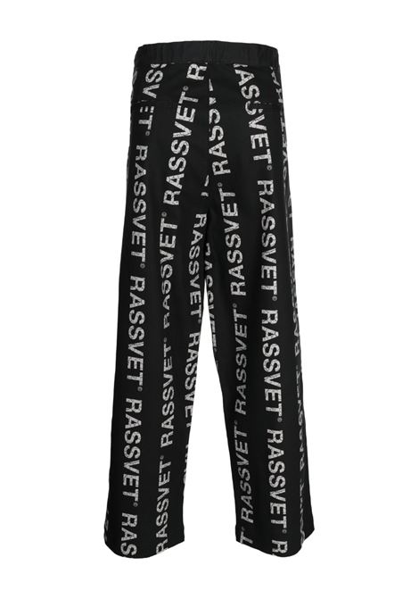 Black logo-print wide-leg trousers - men RASSVET | PACC12P0051