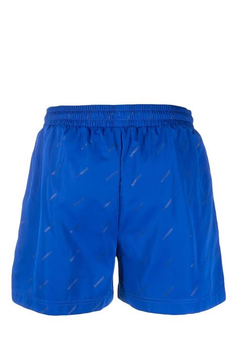 Blue all-over logo print swim shorts - men REPRESENT | M11001109