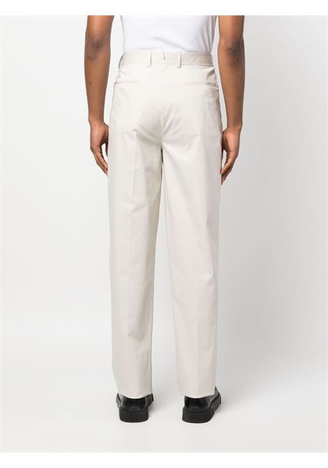 Pantaloni a gamba ampia con pieghe in beige - uomo ZEGNA | 77PM12515F00A5