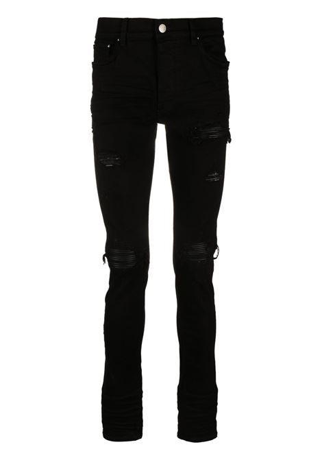 Jeans skinny MX1 con effetto vissuto in nero Amiri - uomo AMIRI | PXMD001BLK