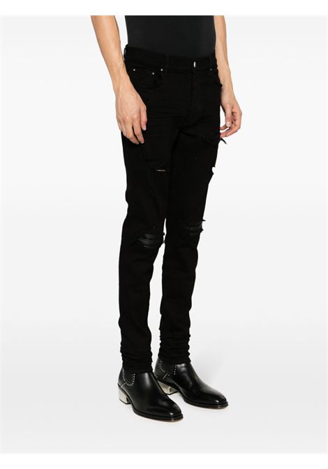 Jeans skinny MX1 con effetto vissuto in nero Amiri - uomo AMIRI | PXMD001BLK