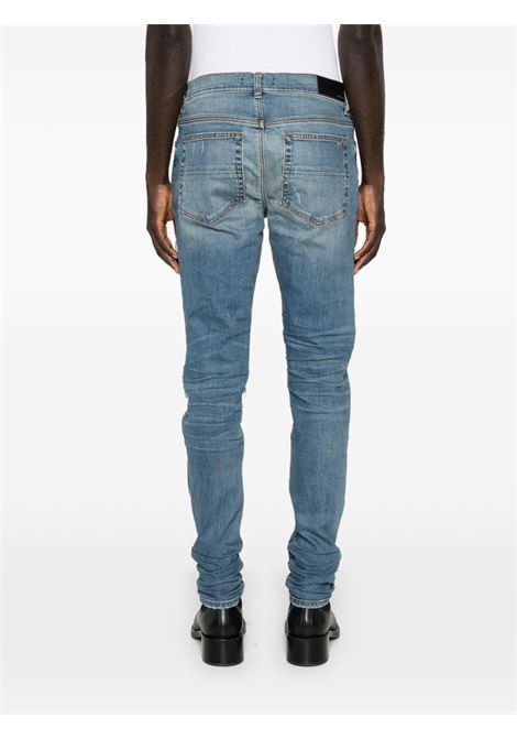 Jeans skinny MX1 con effetto vissuto in blu Amiri - uomo AMIRI | PXMD001DRKINDG