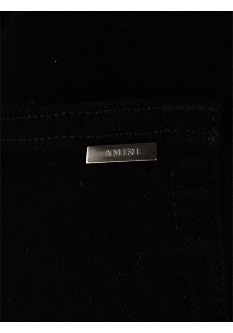 Jeans skinny con applicazione in nero Amiri - uomo AMIRI | PXMD002BLK