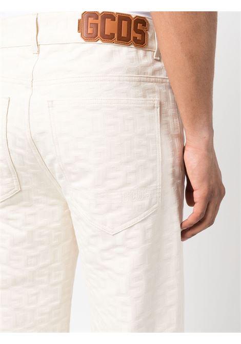 White logo debossed jeans - men GCDS | CC94M26059966