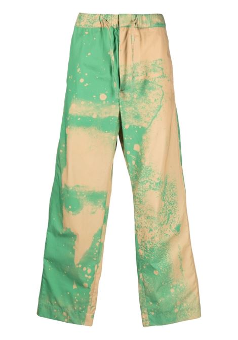 Pantaloni sportivi con effetto vernice spray in verde e beige - uomo OAMC | 23E28OAU31COTOA043324