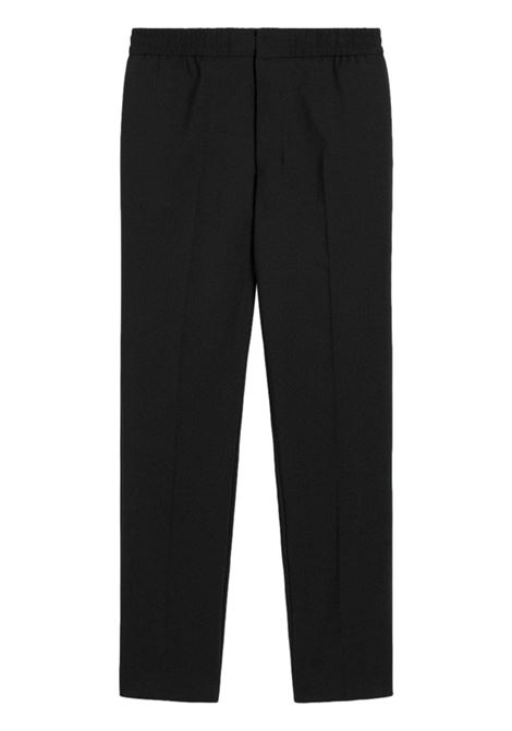 Pantaloni con vita elasticizzata in nero di AMI Paris - uomo AMI PARIS | Pantaloni | HTR226WV0044001